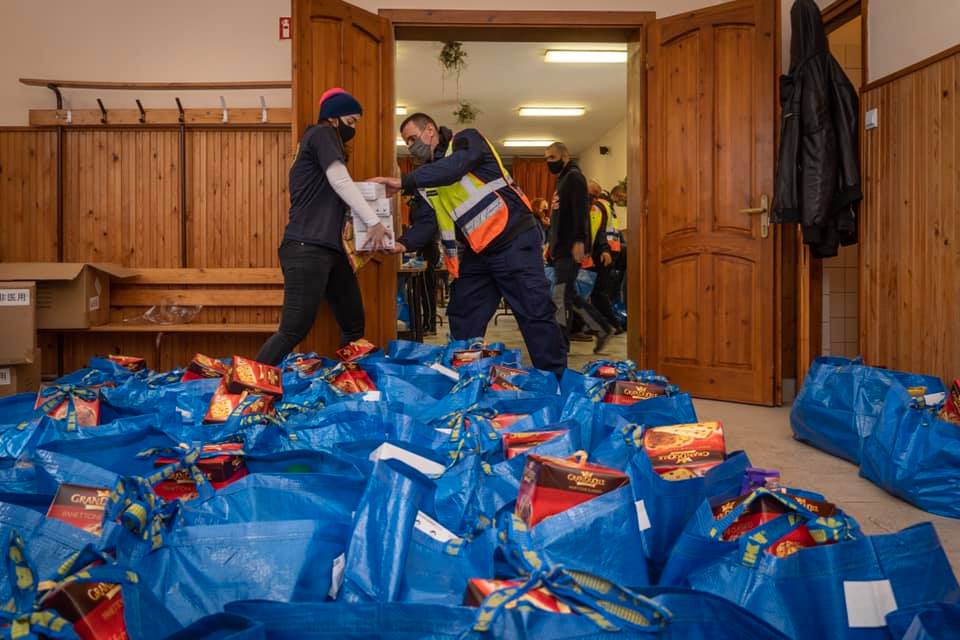Age of Hope volunteers pack food package